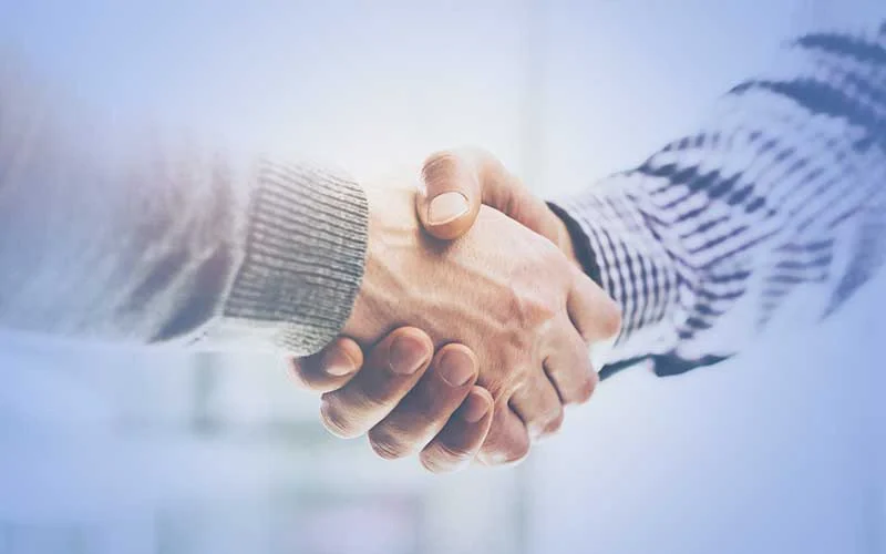 Handshake symbolizing trust and cooperation